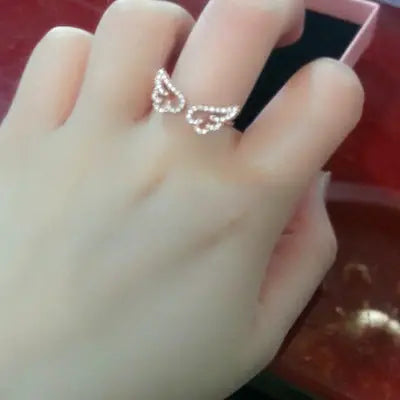 Norvo | Chic Angel Wings Ringer – Glam Tilbehør