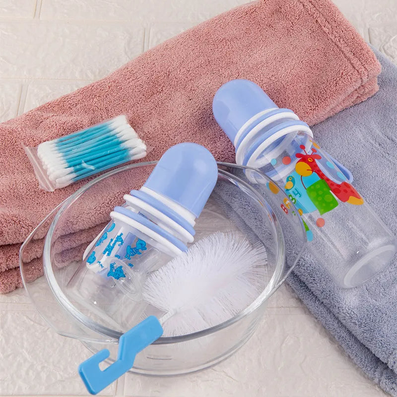 Norvo | Babypleiesett med flasker, smekker og rengjøringsbørste