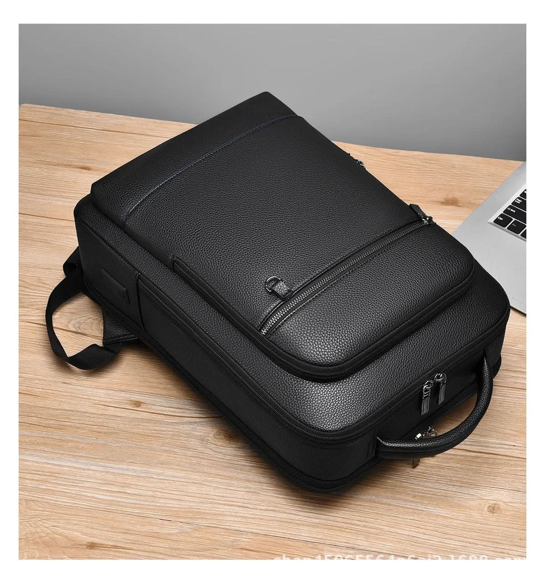 Skanto | Elegant lær ryggsekk for menn/kvinner med USB-port for laptop og hverdagsbruk, 15,6 tommer, svart