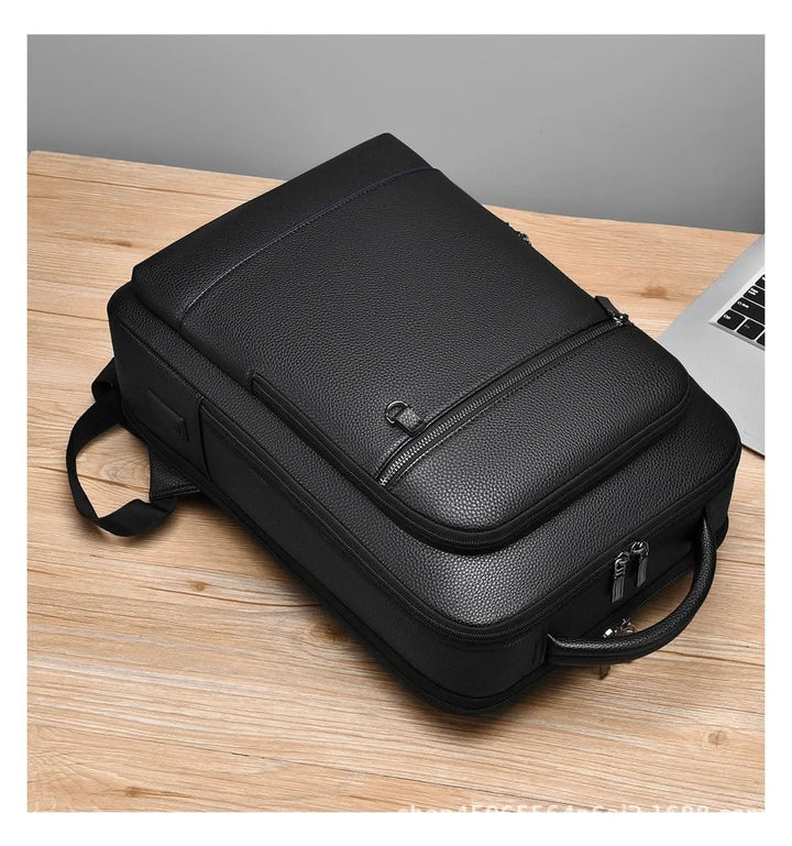 Skanto | Elegant lær ryggsekk for menn/kvinner med USB-port for laptop og hverdagsbruk, 15,6 tommer, svart