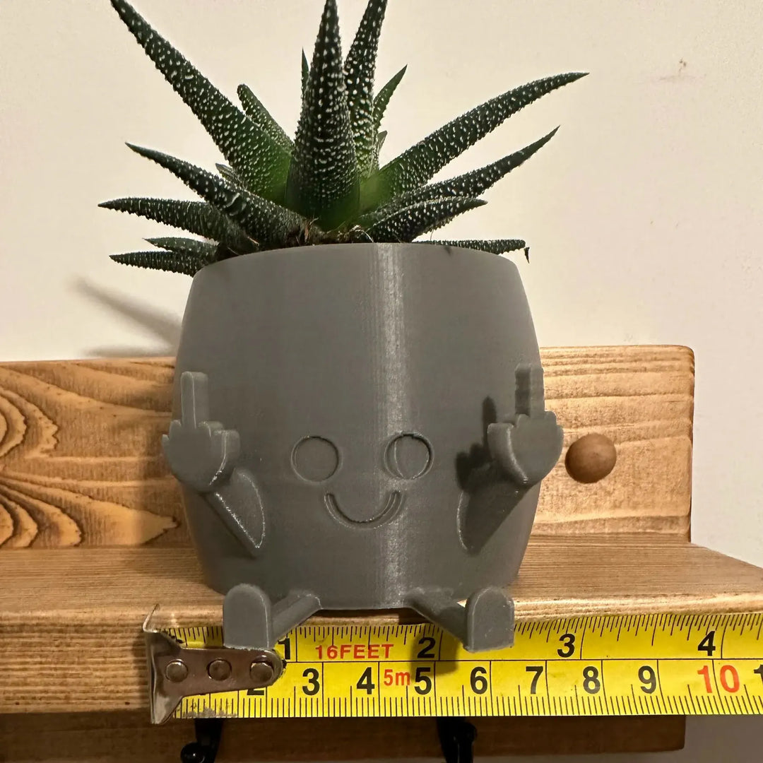 Skanto | Smilende Blomsterpotte med Midtfinger Opp