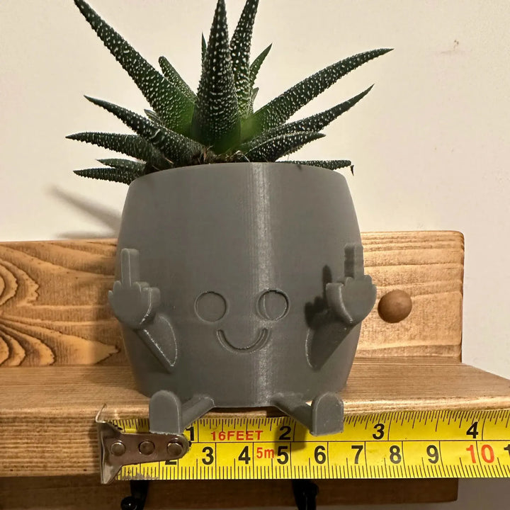 Skanto | Smilende Blomsterpotte med Midtfinger Opp