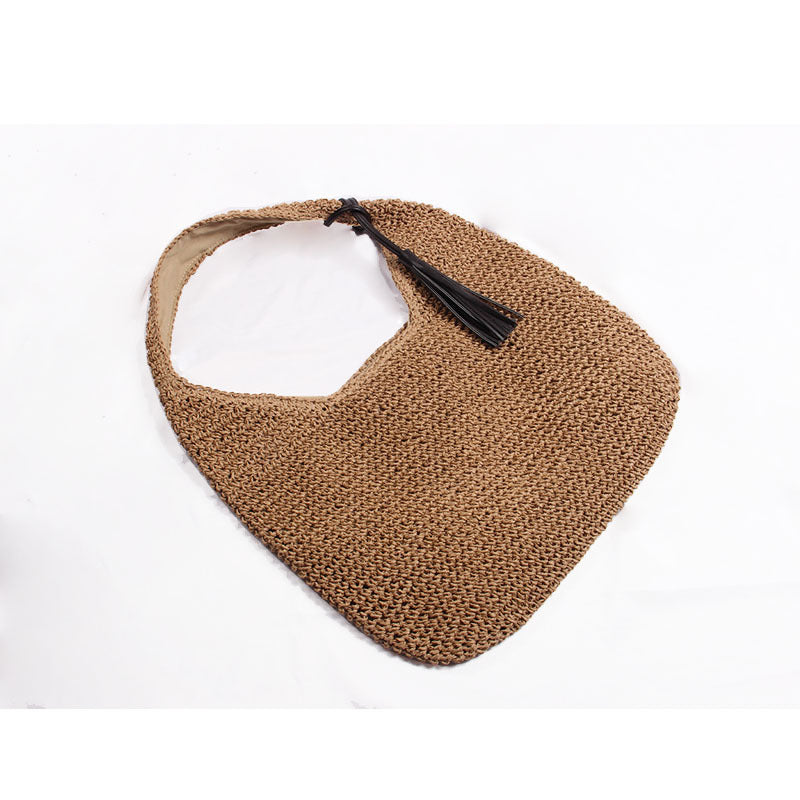 Handmade and stylish shoulder bag with decorative tassel detail Skanto