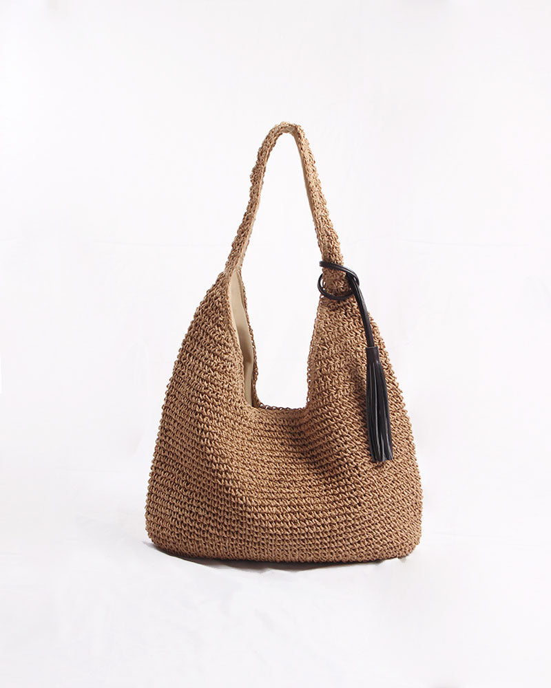 Handmade and stylish shoulder bag with decorative tassel detail Skanto