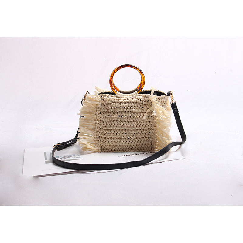 Handmade straw crossbody bag with fringe details Skanto