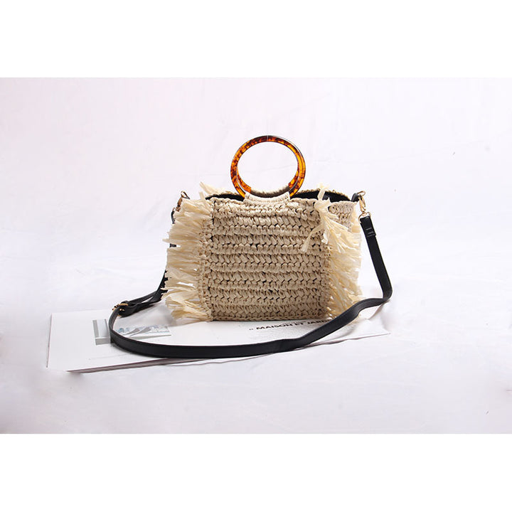 Handmade straw crossbody bag with fringe details Skanto