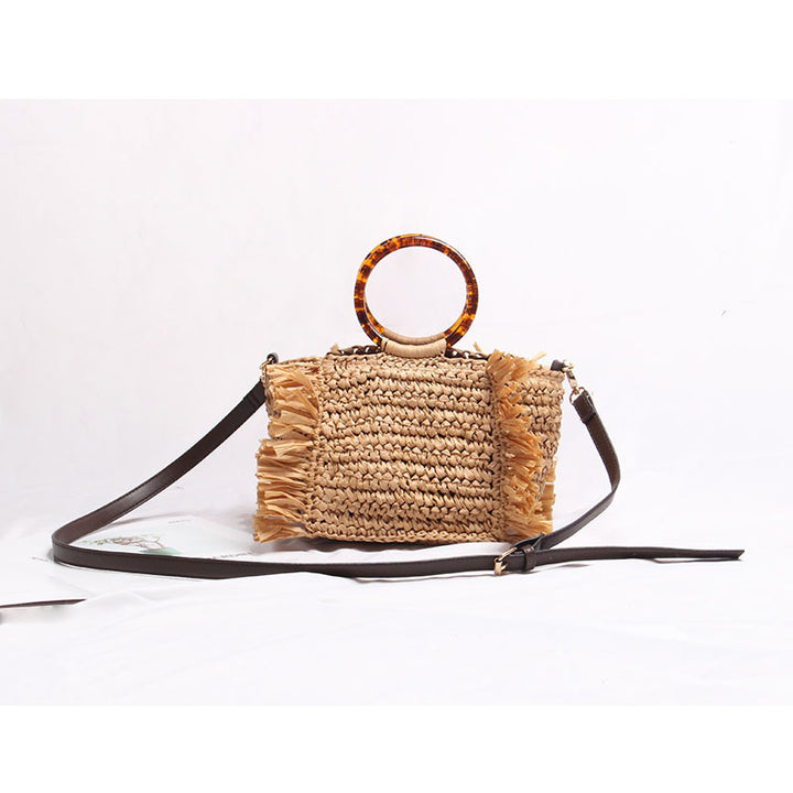Handmade straw crossbody bag with fringe details Skanto
