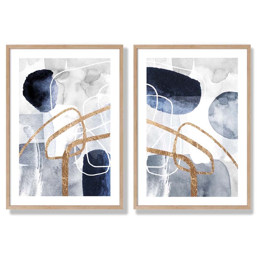 Sett med 2 kunsttrykk i abstrakt rammedesign i blått og gull