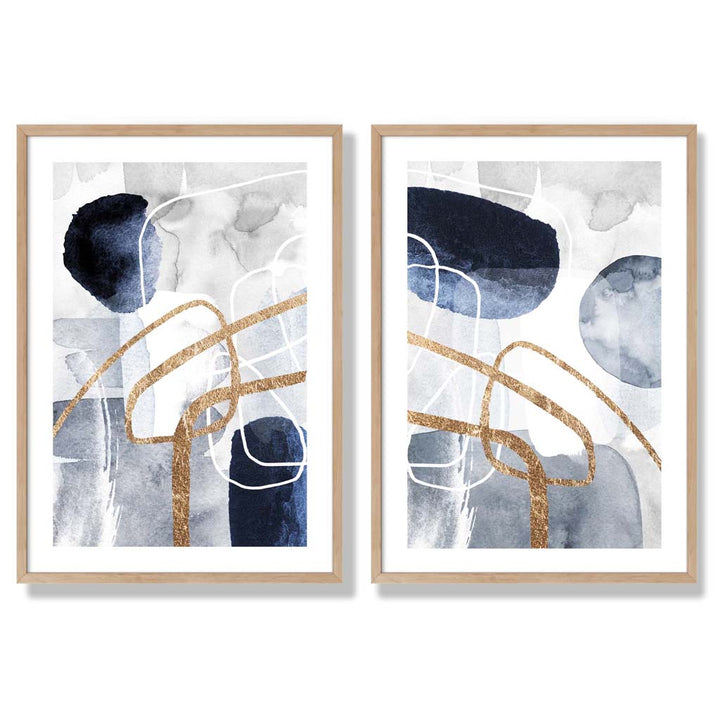 Sett med 2 kunsttrykk i abstrakt rammedesign i blått og gull