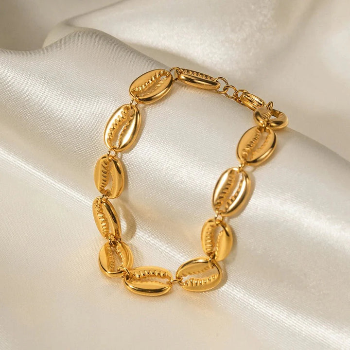 Skanto | 18k Delikat Cowrie Shell Armbånd