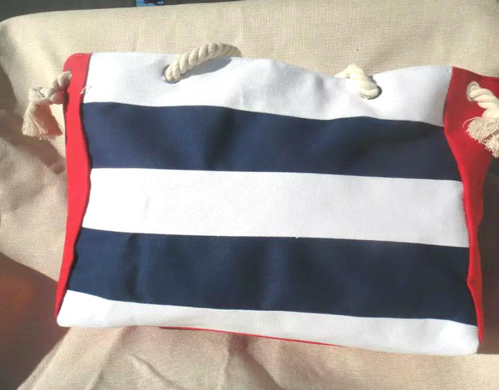 Handlepose med maritime striper og robuste tauhåndtak Skanto
