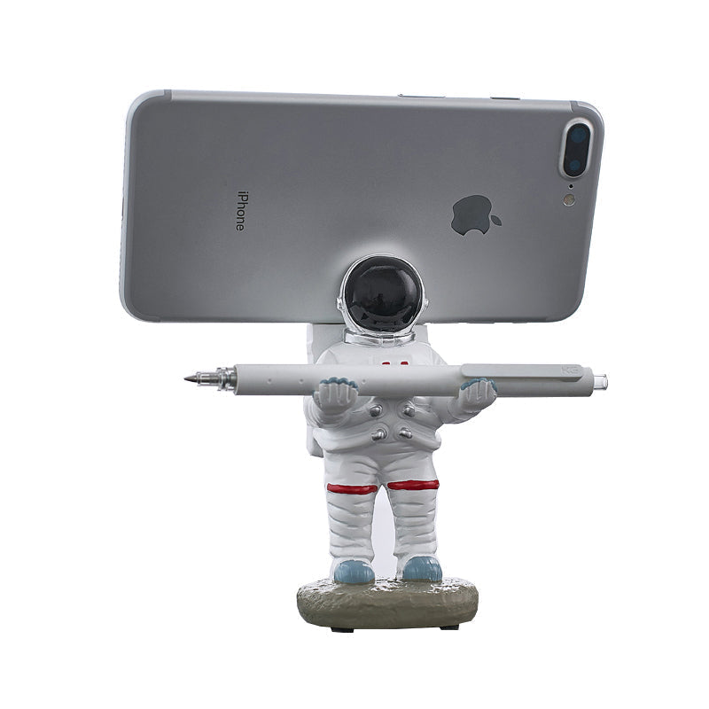 Støtte for telefoner eller penner i astronautdekorasjoner | Skanto