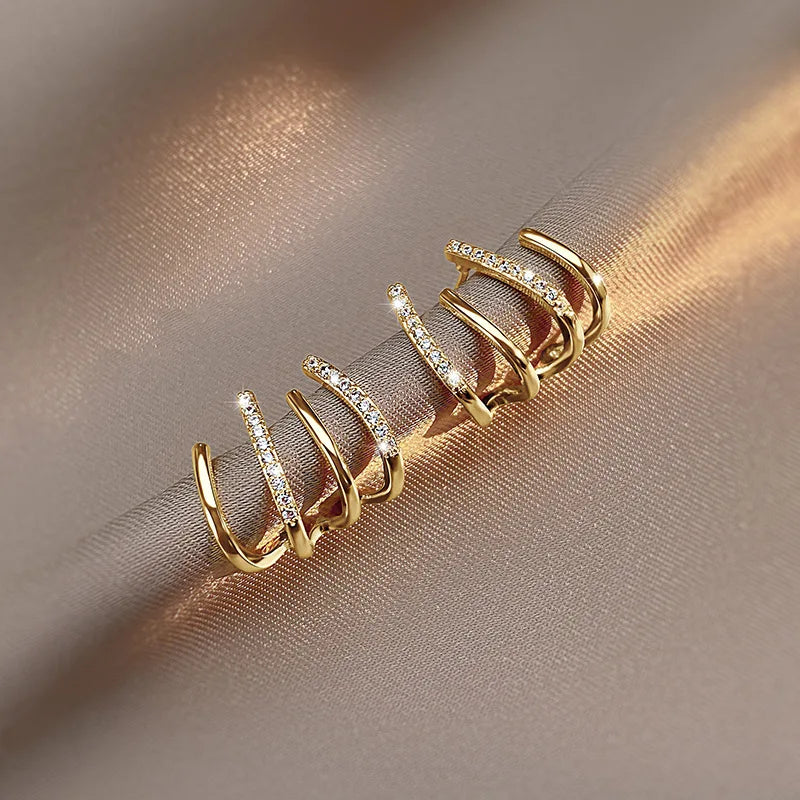 Skanto | Vridde Øredobber | Elegant Design | Gull eller Sølv