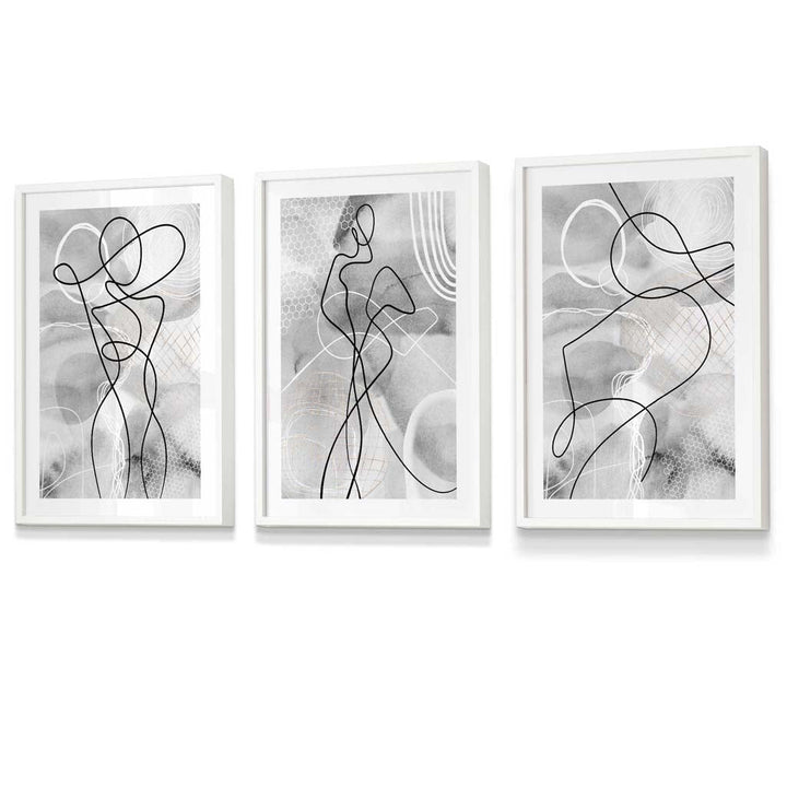 Abstrakt sett med 3 innrammede kunsttrykk med motiver fra moteverdenen i svart og grått.