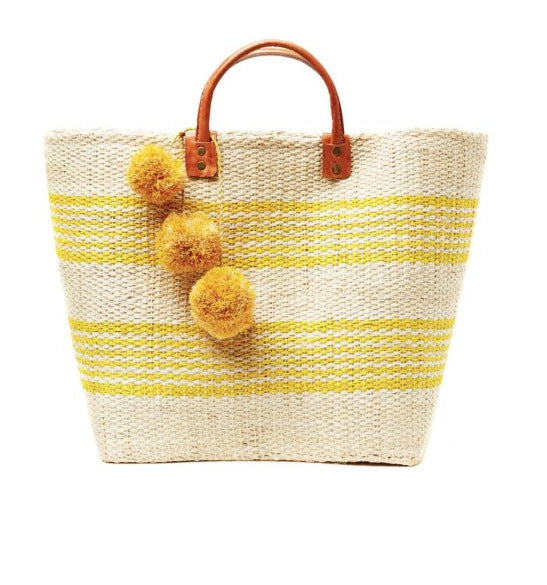 Stylish straw bag with playful pom-poms Skanto