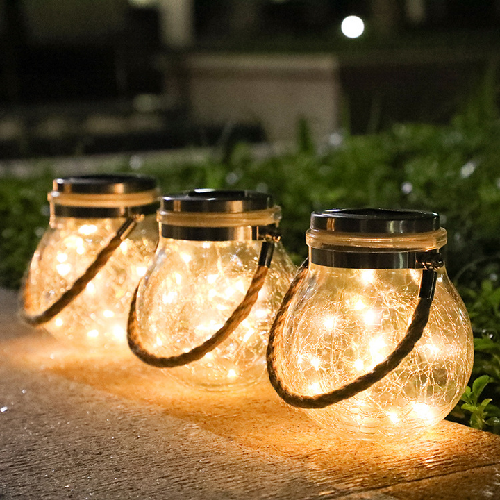 Skanto | Solenergi LED-lanterne i glass – Dekorativ hagebelysning med ledninger og bærehåndtak