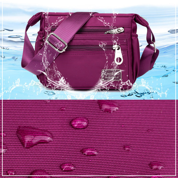 Skanto | Kvinners Multi-lags Nylon Crossbody Bag