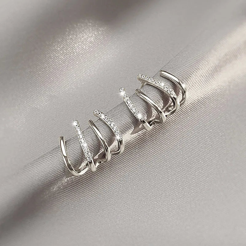 Skanto | Vridde Øredobber | Elegant Design | Gull eller Sølv