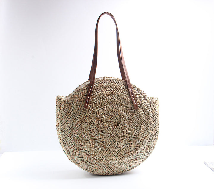 Braided straw beach bag with elegant leather handles Skanto
