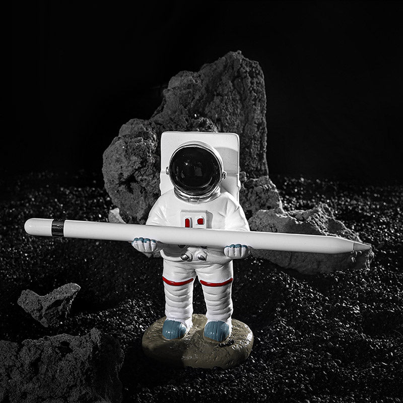 Støtte for telefoner eller penner i astronautdekorasjoner | Skanto