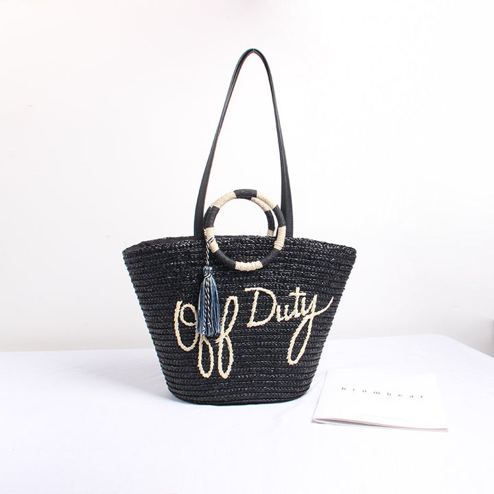 Designer Straw Bag with Playful Text and Decorative Pom Pom Skanto