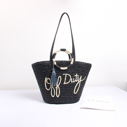 Designer Straw Bag with Playful Text and Decorative Pom Pom Skanto