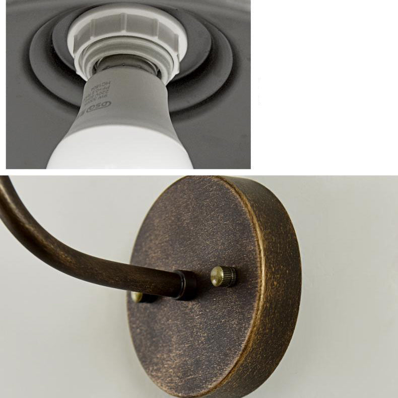 Rund, lokkformet vegglampe med buet jernskjerm og enkeltflammedesign for terrassen