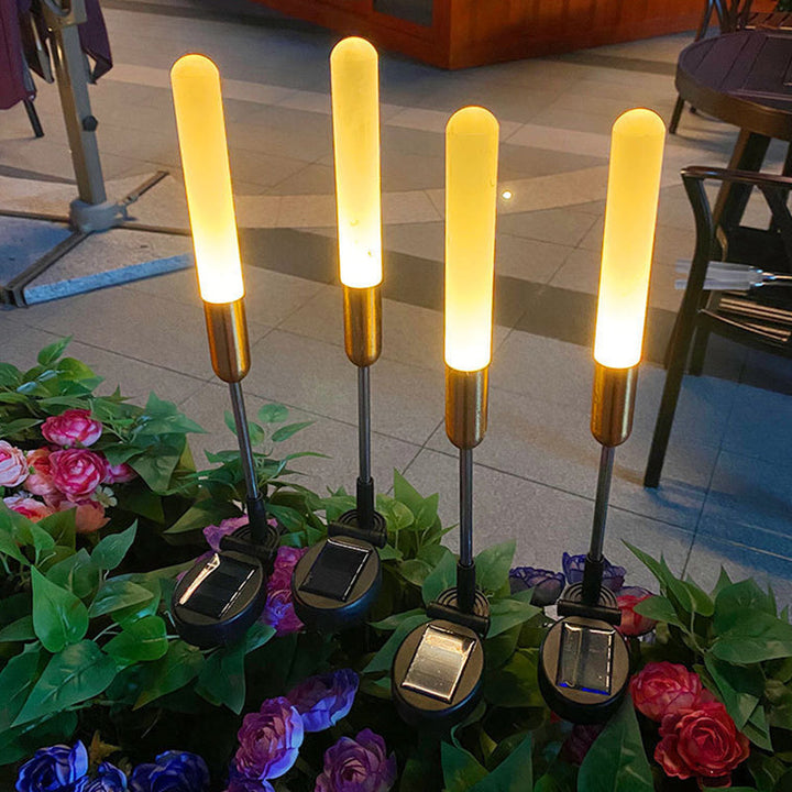 Vanntett solcelledrevet sylinderlampe laget av akryl, aluminium, rustfritt stål og ABS med LED-belysning for utendørs bruk og hagedesign.