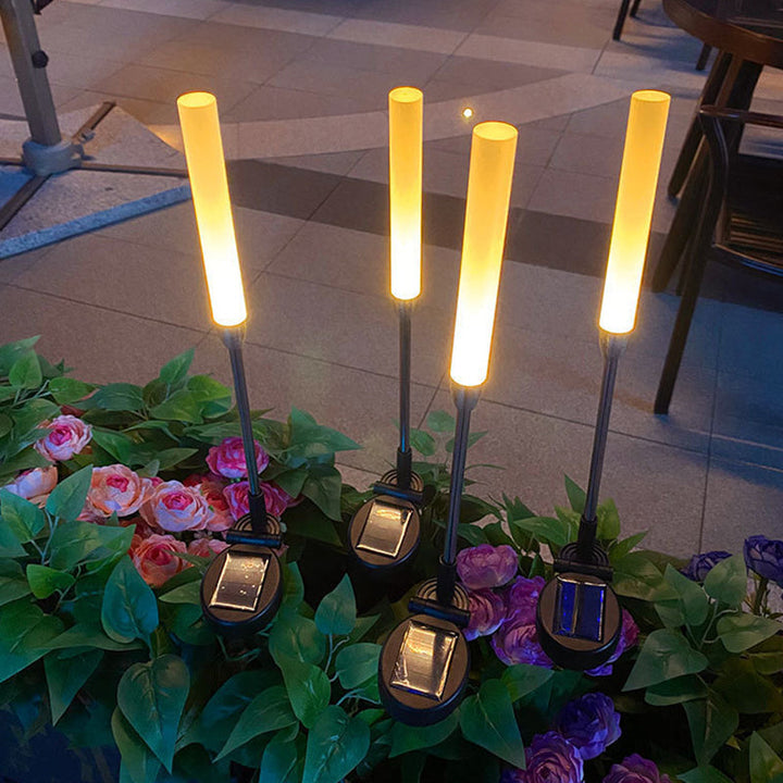 Vanntett solcelledrevet sylinderlampe laget av akryl, aluminium, rustfritt stål og ABS med LED-belysning for utendørs bruk og hagedesign.