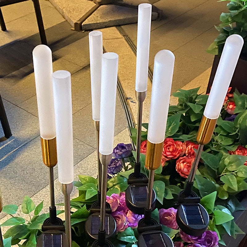Vanntett solcelledrevet sylinderlampe laget av akryl, aluminium, rustfritt stål og ABS med LED-belysning for utendørs bruk og hagedesign.