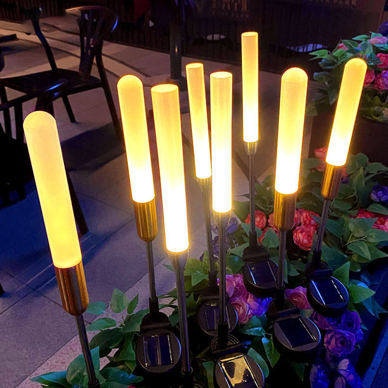 Vanntett solcelledrevet sylinderlampe laget av akryl, aluminium, rustfritt stål og ABS med LED-belysning for utendørs bruk og hagedesign.