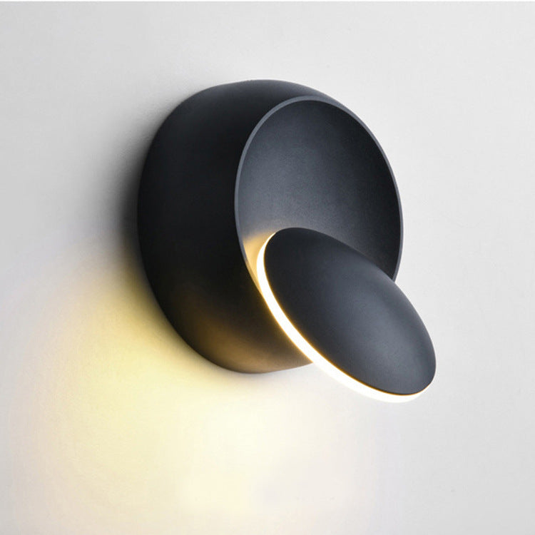 Skanto | Moderne nordisk jern rund eklips roterbar LED vegglampe for nattbord
