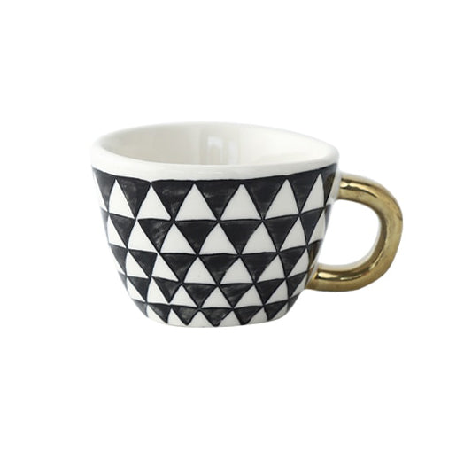 Kopp med abstrakt geometrisk monster og måkehank