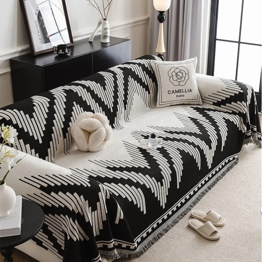 Skanto | Elegant svart og hvitt sofa dekke beskytter