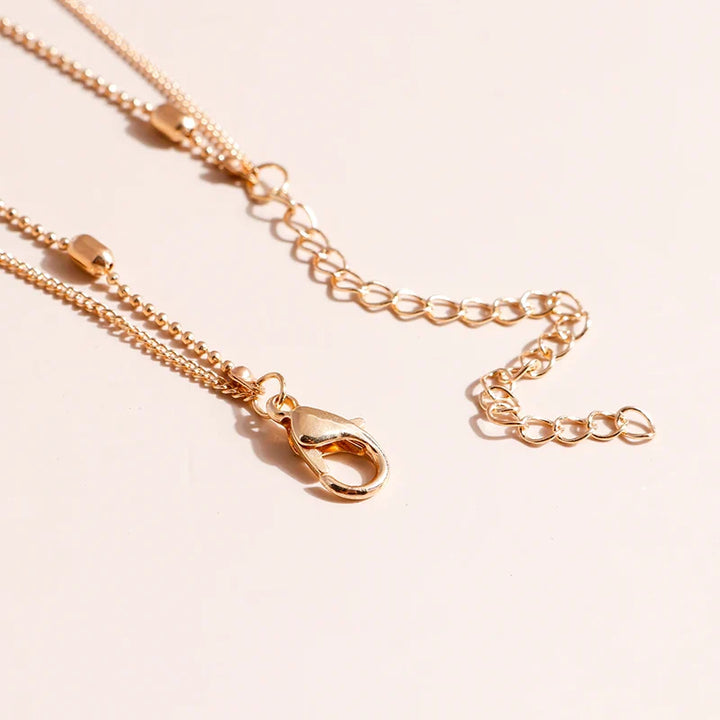 Skanto | Delikat Lagd Choker og Korshalssmykke