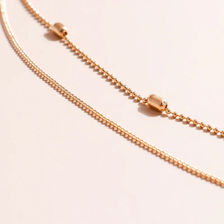 Skanto | Delikat Lagd Choker og Korshalssmykke