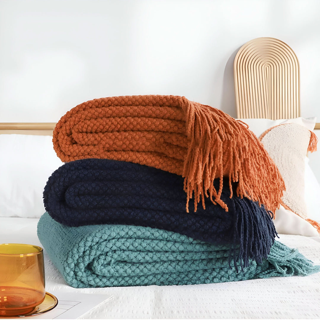 Skanto | KNITCOVE – Stilig strikket fleece teppe
