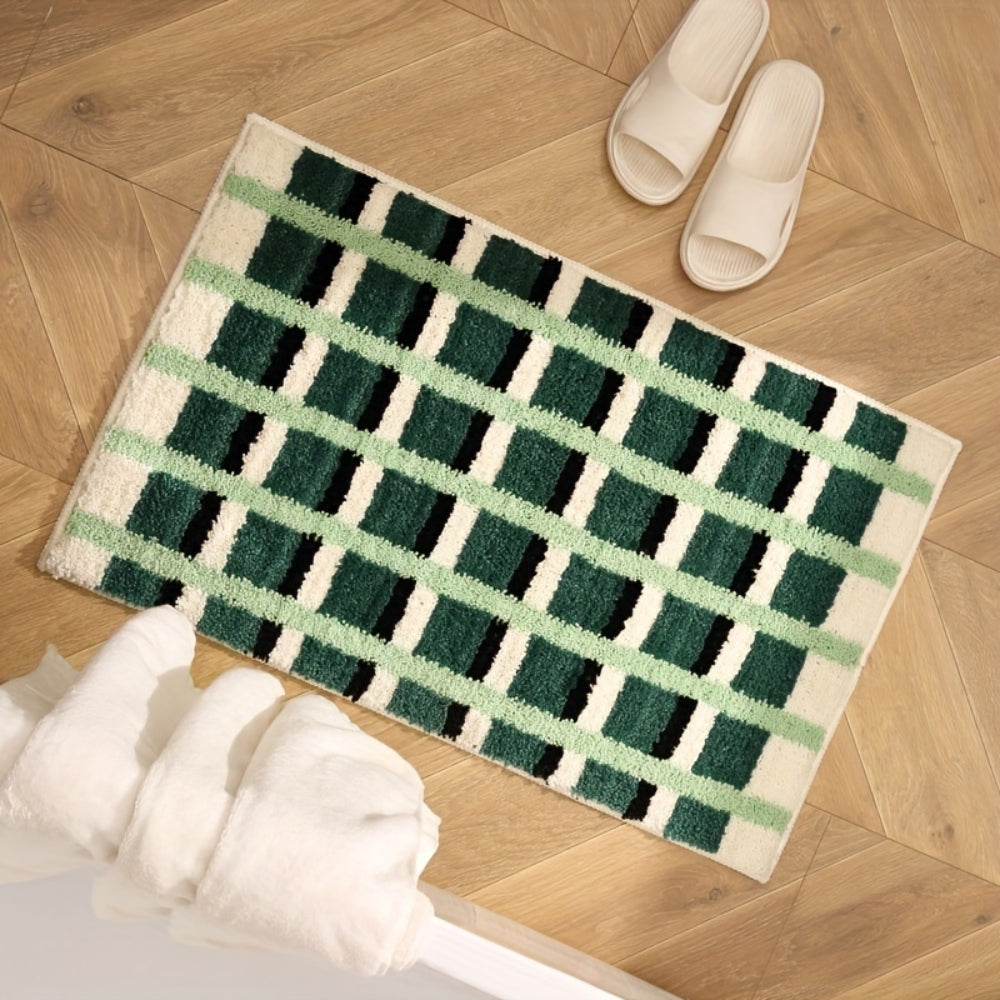 Moosgrüne Badematte mit geometrischem Flockmuster