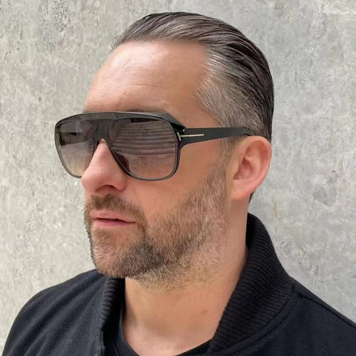 Dame modische solbrille med markant geometri og brune glass Skanto
