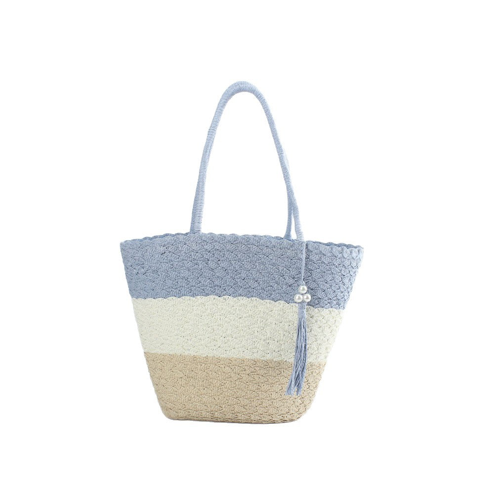 Moderne hekle-crossbody-veske med dusker Skanto