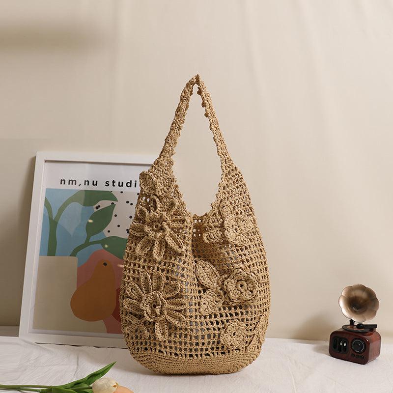 Crocheted shoulder bag with floral appliqués Skanto