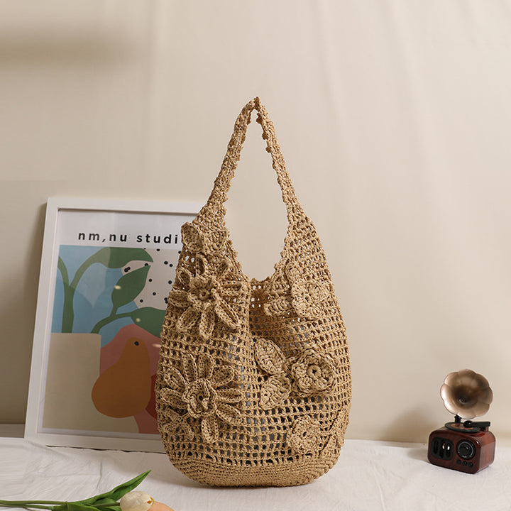Crocheted shoulder bag with floral appliqués Skanto