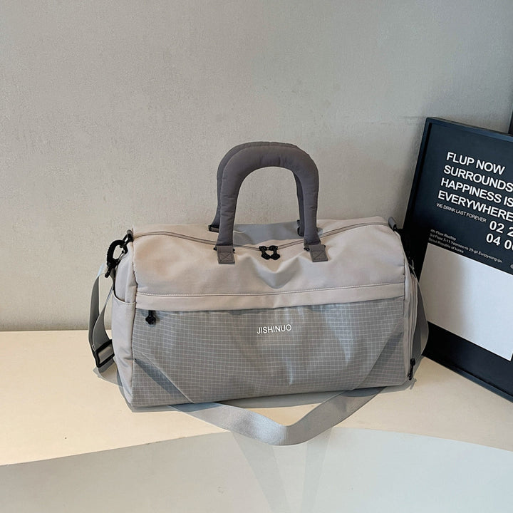 Sporty fritids-duffelbag med ergonomiske håndtak og flere rom Skanto