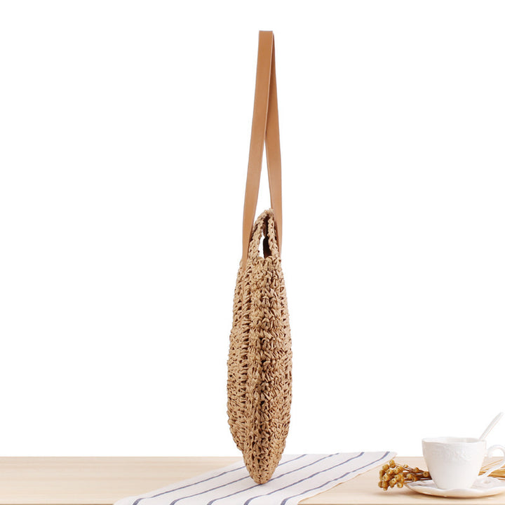 Round straw bag with leather handle Skanto