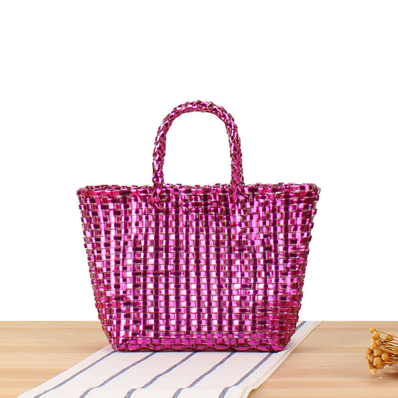 Handbag made of woven natural material with elegant accents Skanto