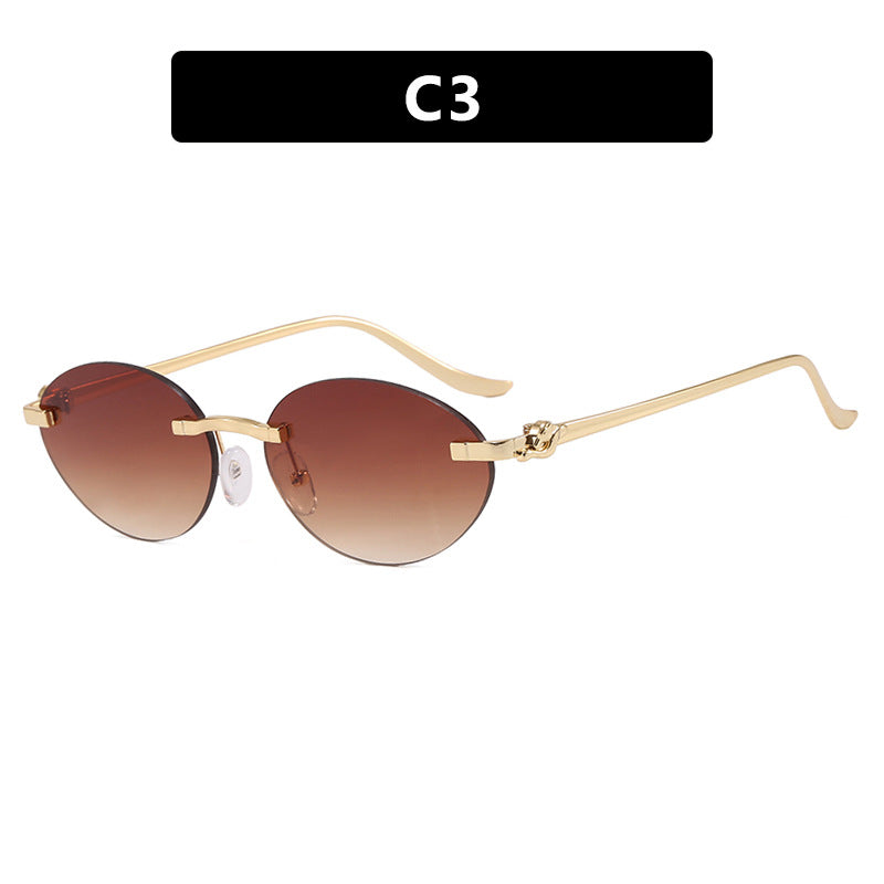 Women's elegant oval sunglasses with gold accent Skanto