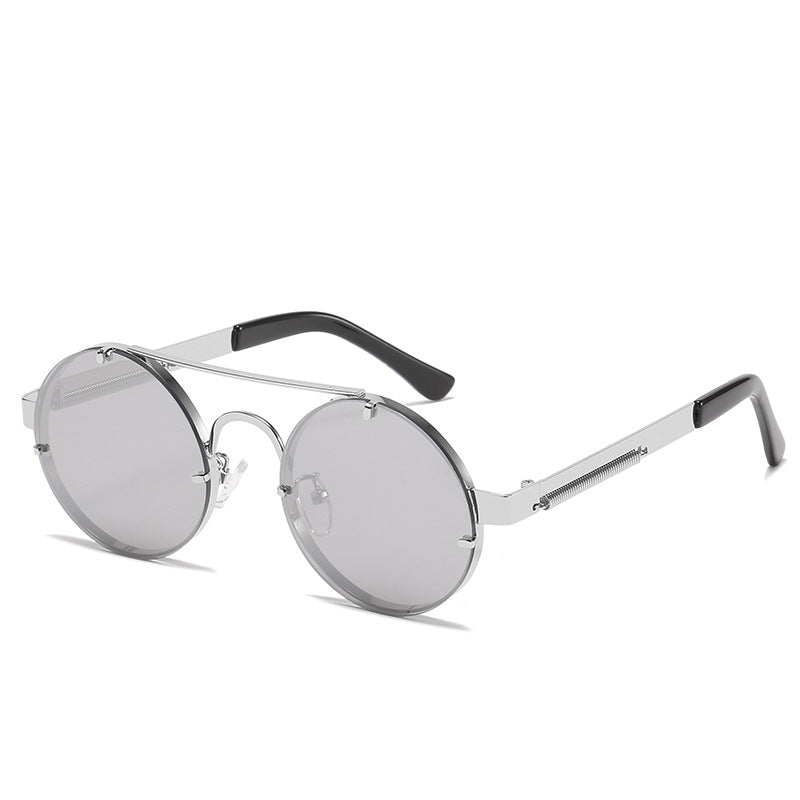 Dame rund designer solbrille med innovativ metallramme og beskyttende linser Skanto