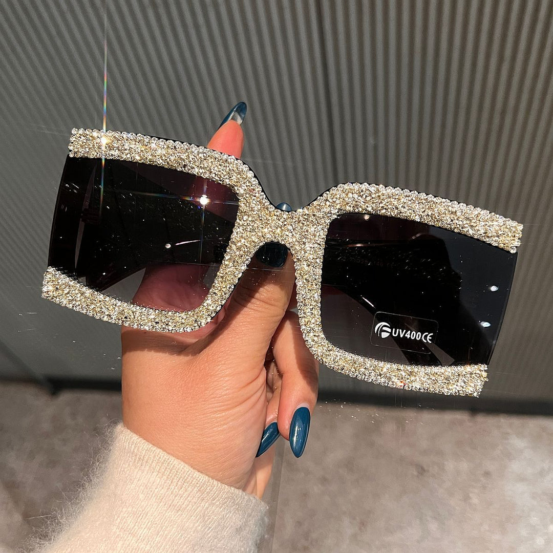 Dame solbrille med strassdekorert ramme Skanto