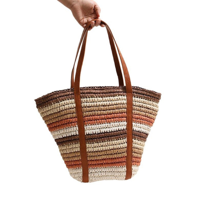 Braided straw bag with sturdy leather handles Skanto