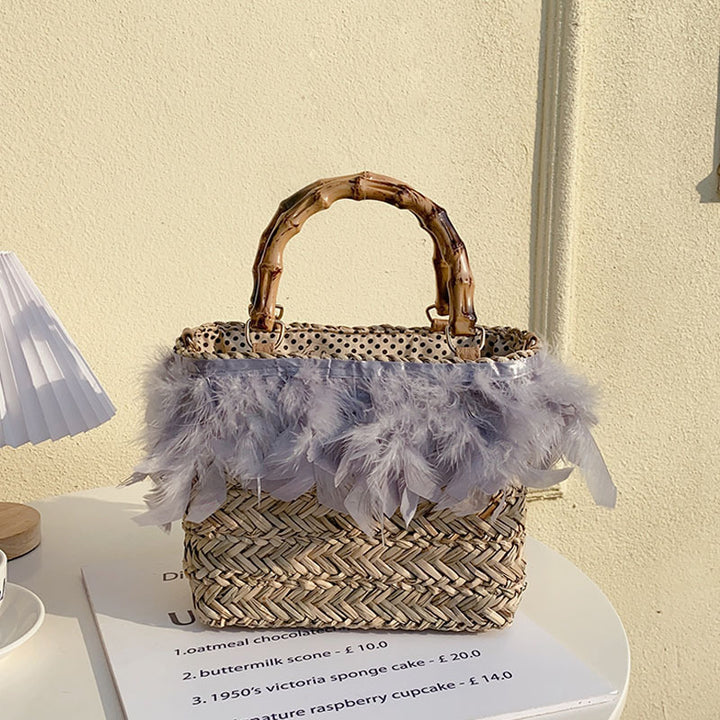 Elegant handbag with feathers and bamboo handle Skanto